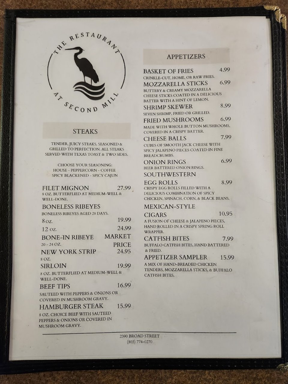 Printed menu with drinks and dining options.